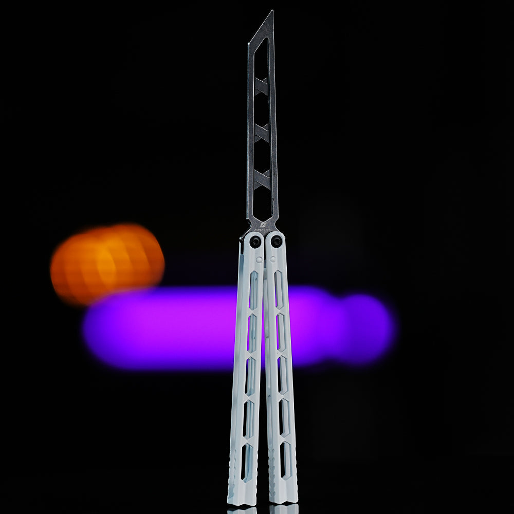 Armed Shark Prism Balisong Trainer back view showing skeletonized stainless steel training edge and balanced handle design