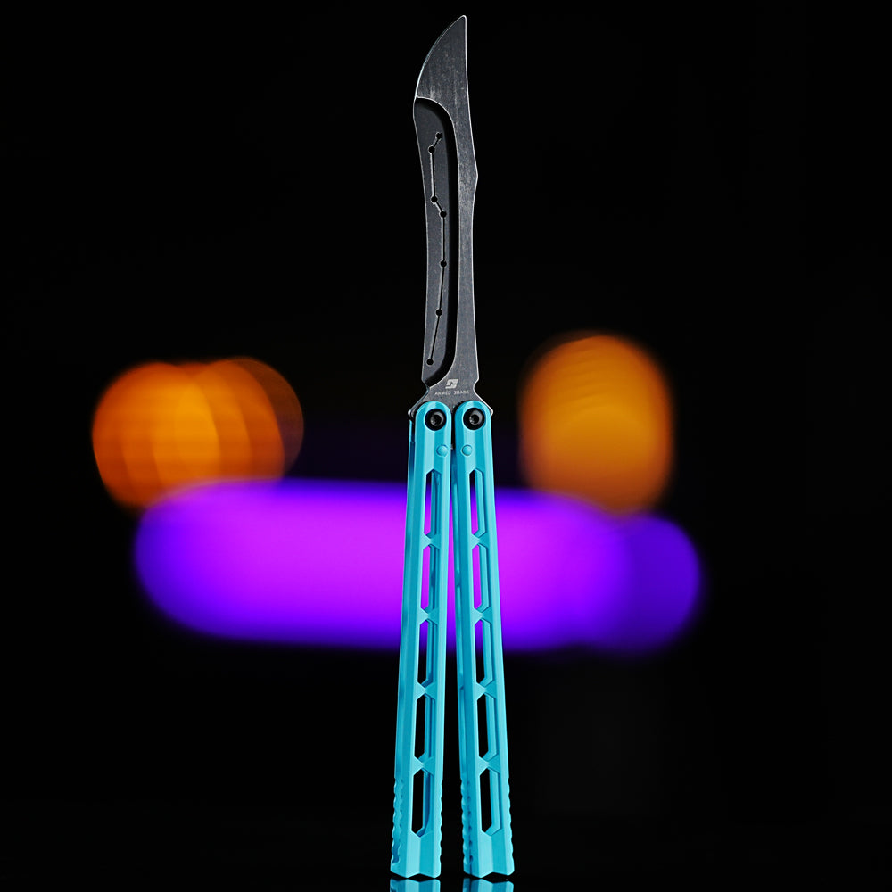 Armed Shark Prism Balisong Trainer in blue color front view showing titanium-coated handle and stone-washed stainless training edge