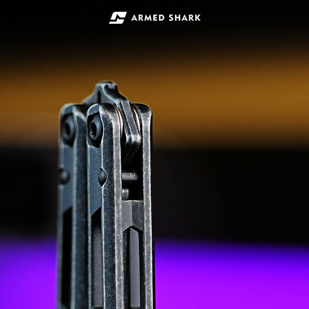 Armed Shark Prism Balisong Trainer pivot and bushing system close-up showing T10 screws and stable hinge design