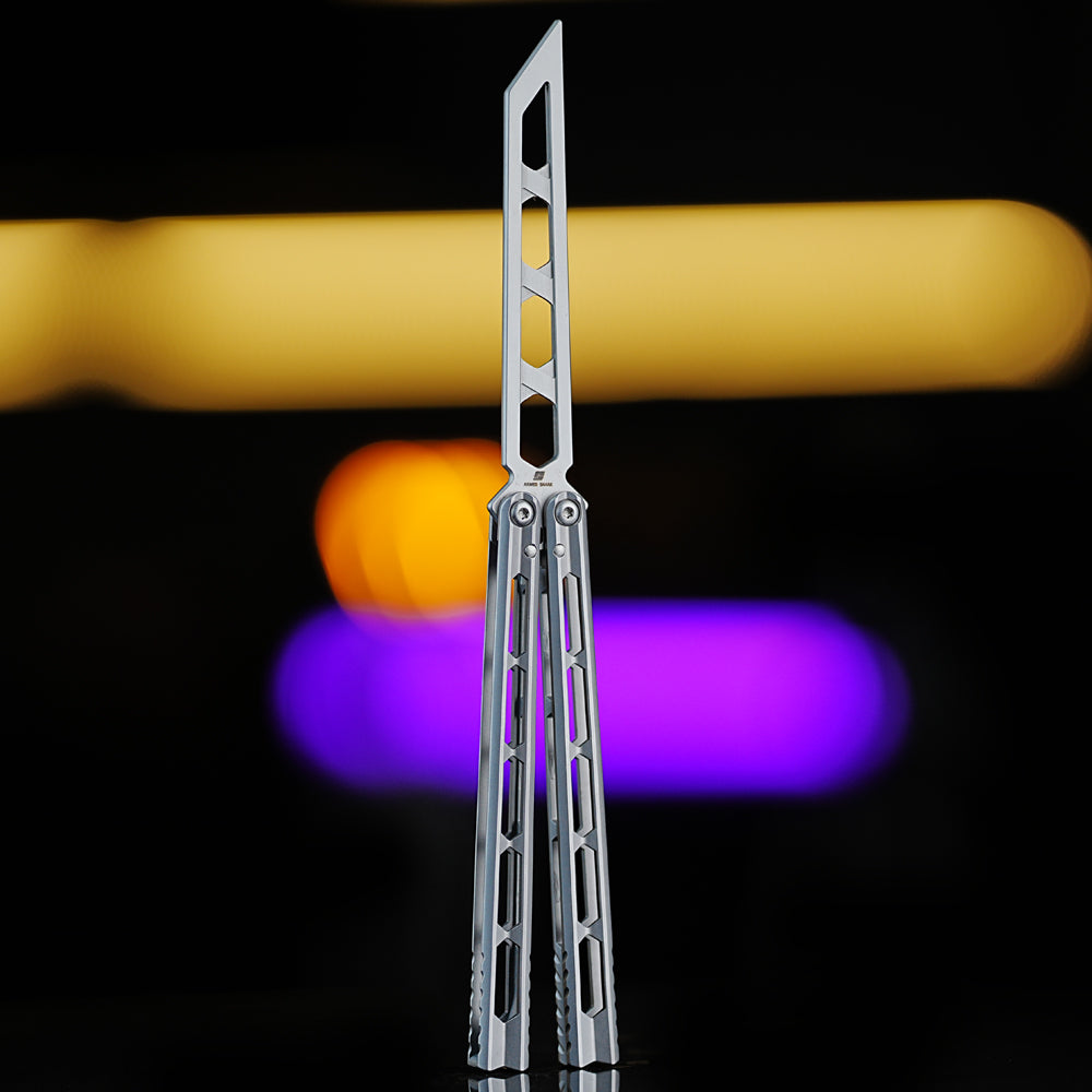 Armed Shark Prism Balisong Trainer in silver color back view showing skeletonized stainless training edge and lightweight handle design