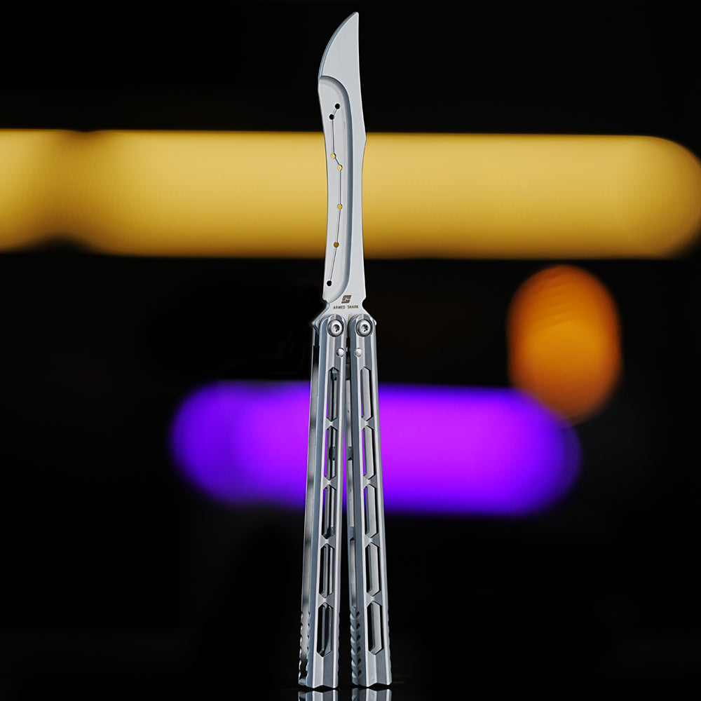 Armed Shark Prism Balisong Trainer in silver color front view showing polished stainless handle and unsharpened training edge