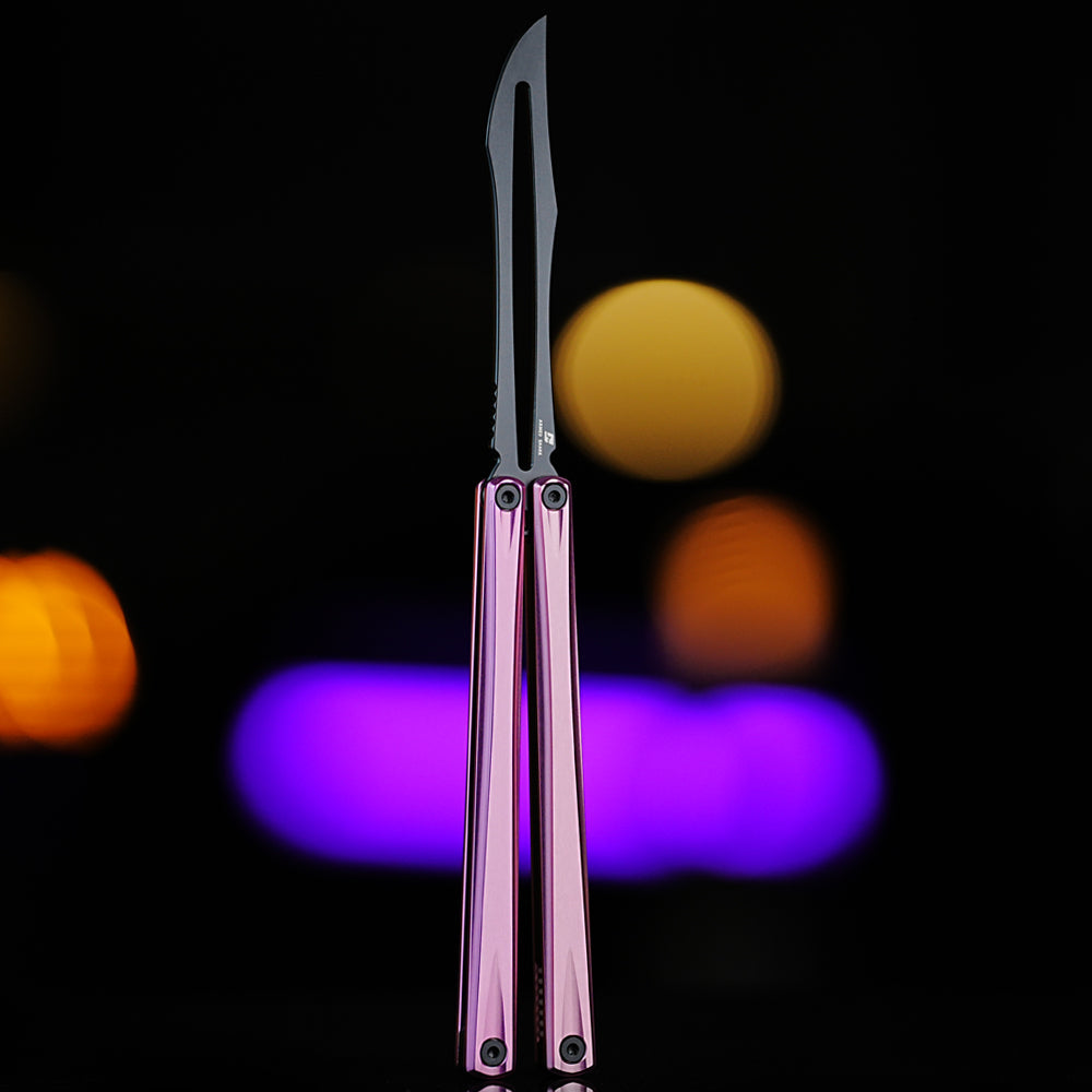 Front view of Armed Shark Eureka Balisong Trainer in pink with black training edge, showing reflective anodized handles and CNC-machined details under soft studio lighting